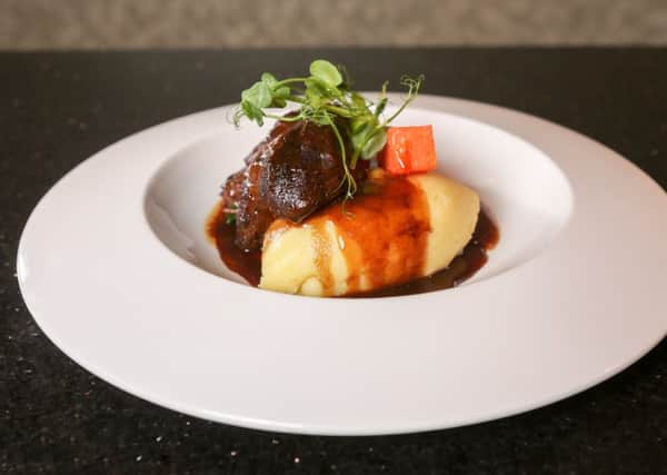 Six hour slow braised Lancashire ox cheek, horseradish potato, buttered kale, confit carrots, sticky beef and port sauce (serves four)