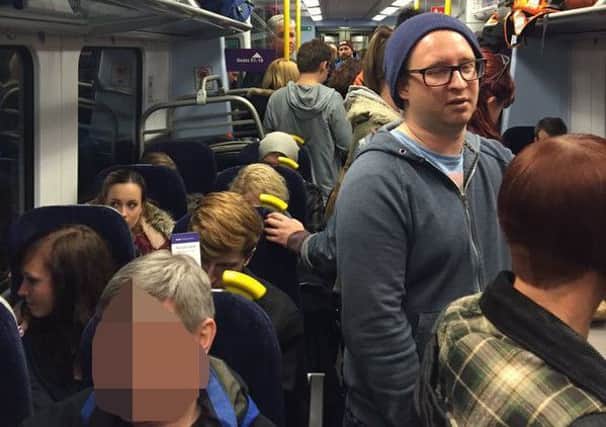 A photo from a passenger shows the cramped conditions on rush hour services