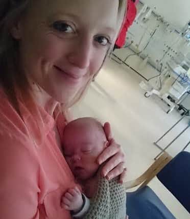 Annemarie Bell holds niece Abi for the first time