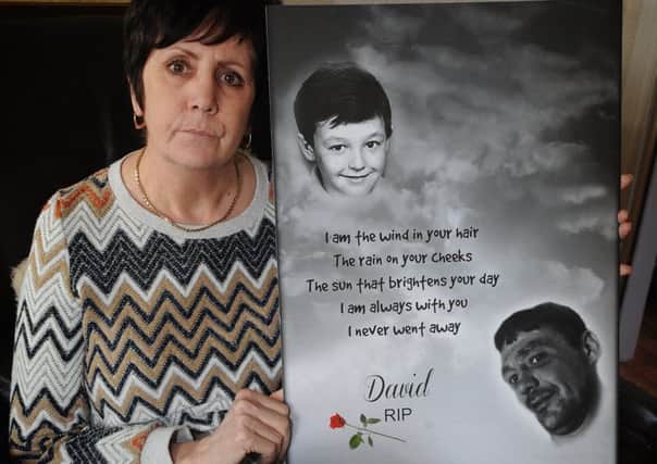 Karen with a memorial painting for her son David