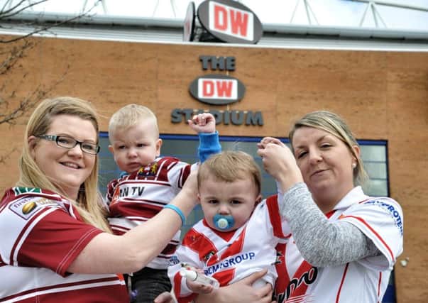 Emma Doherty, her son Bobby (22 months), Michelle Travis and her son James (19 months), who are going to do a charity walk from St Helens to the DW Stadium for the Good Friday match pictured outside the DW Stadium