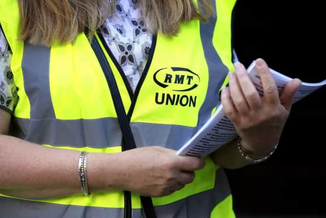 An RMT member on a picket line
