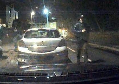 A youth kicks a car wing mirror off in Lodge Road, Orrell