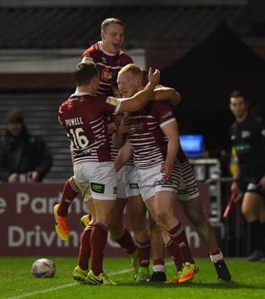 Liam Farrell is congratulated on his try at Warrington