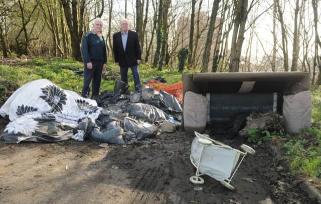 WIGAN  15-03-17]
from left, Coun John Hilton and Coun George Davies next to rubbish which has been fly-tipped, on Co-op Street, off Platt Lane, Wigan.