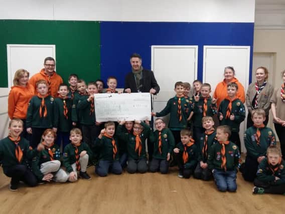 The Cubs present Warren Done with a cheque