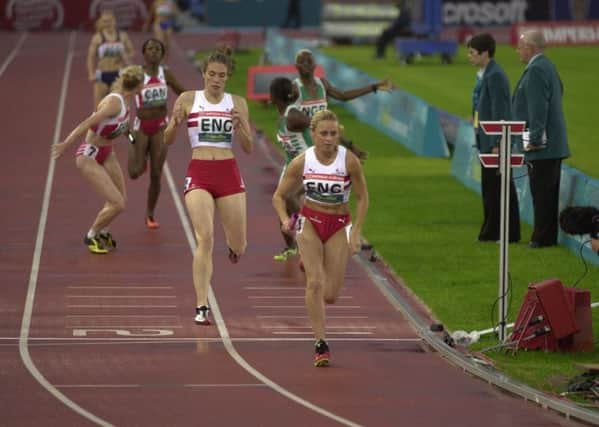 Wigan's Jenny Meadows takes over the baton to help England win their heat of the 4 x 400 Metres Relay at The Commonwealth Games at The City of Manchester Stadium