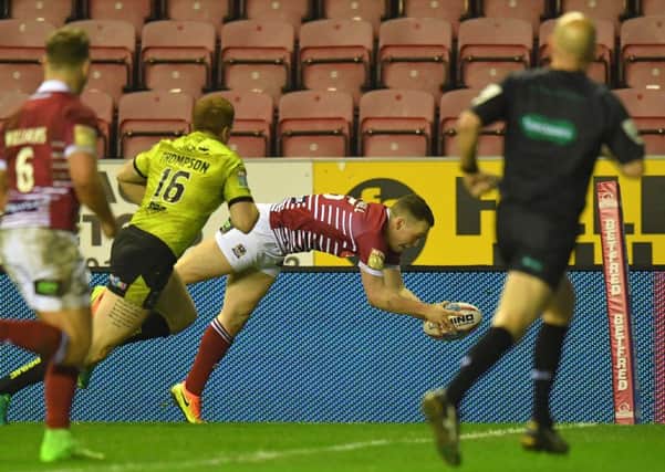 Liam Marshall scores Wigan's fourth try to give them hope