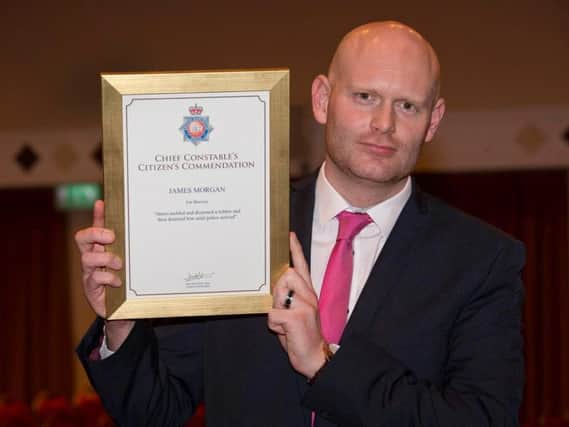 James Morgan with his police bravery award