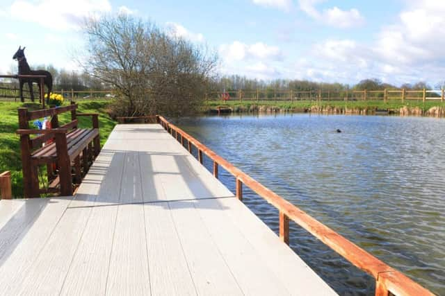 Leigh MP Andy Burnham officially opens the new fishing pond, with access for disabled and elderly visitors, at Hope View Sensory Farm, Astley