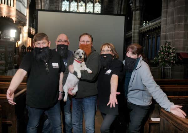 Members of Leigh Film get ready for the screening with Fr Kevin Crinks and his dog Brian