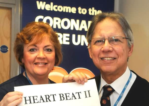 Matron Carolyn Dereszkiewcz and Dr Naqvi with the logo for the  Heart Beat 2 appeal