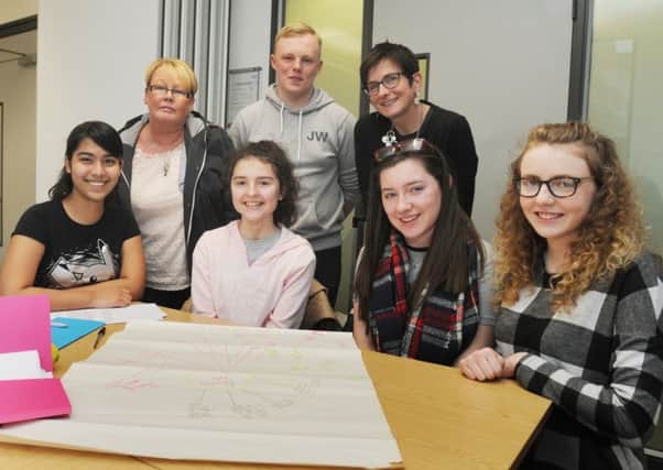Young health champions during a workshop, inspired by Diane Roberts, (second from left) who's daughter Jemma-Louise Roberts died aged 13 from sepsis, also pictured with Jemma-Louise's brother Joseph (back centre) and Wigan Council chief executive Donna Hall (back right)