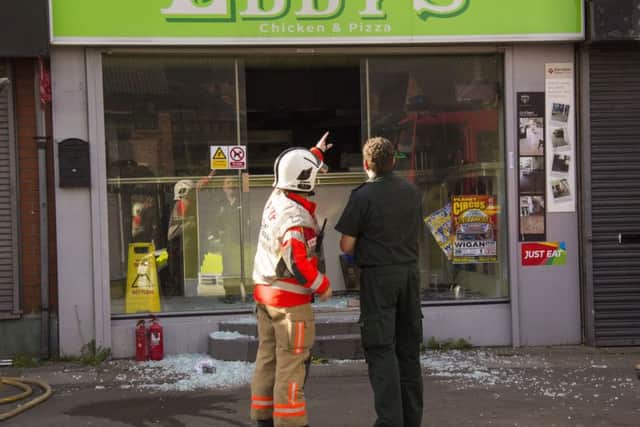 Firefighters forced their way into Eddy's Chicken And Pizza. Pic: Fiona Pendlebury