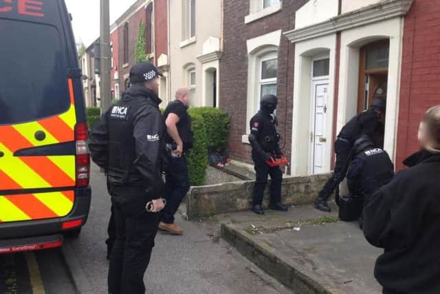 Police at the scene of one of the raids