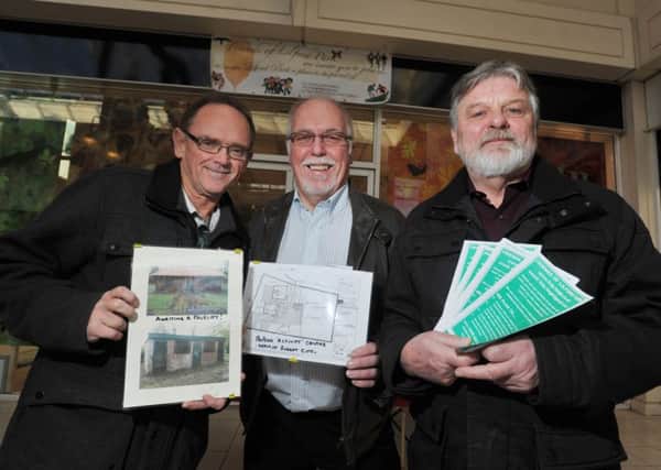 Members of Friends of Lilford Park, from left, Stephen Aspden, David Sykes and Alan Cox, are campaigning for now facilities at the park held at stall with information for shoppers to enquire at Spinning Gate shopping centre, Leigh