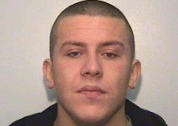 Wanted for kidnap and robbery: Andrew Evans