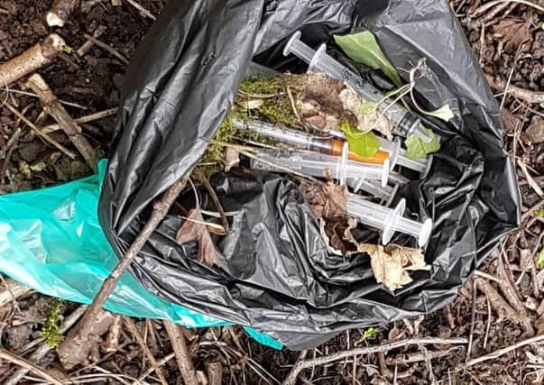 Bags of syringes collected by Lizzie Hagan