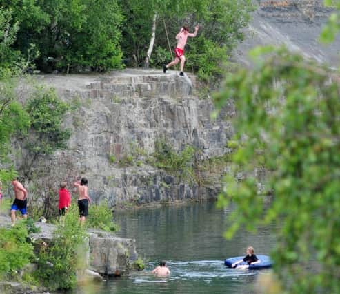 Photo: David Hurst
Youths ignore the dangers of swimming in Appley Bridge Quarry, Wigan