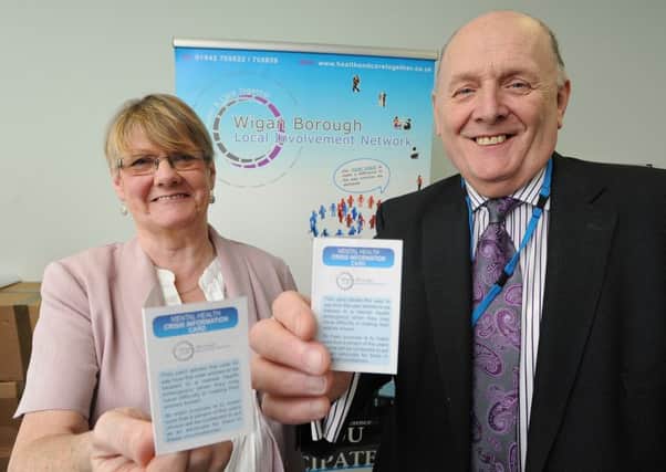 Chris Arkwright, the chair of the Mental Health Task Group, and Bernard Pilkington, chair of Five Boroughs Parnership Trust, at the launch of the Wigan Borough Local Involvement Network's Mental Health Crisis Card at Boston House Wigan Health Centre on Frog Lane