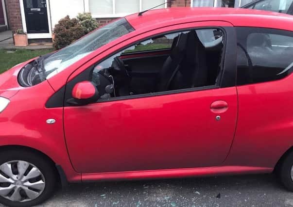A cars window smashed in Winstanley