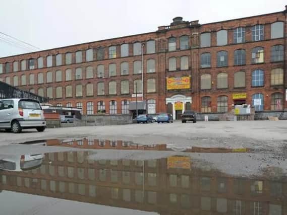 The site of Eckersley Mills encompasses many derelict industrial buildings