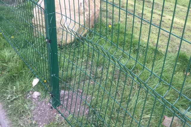 A fence put up at Golborne Sports JFC to stop vehicles wrecking the pitches which has already been damaged, either by vandals or trespassers