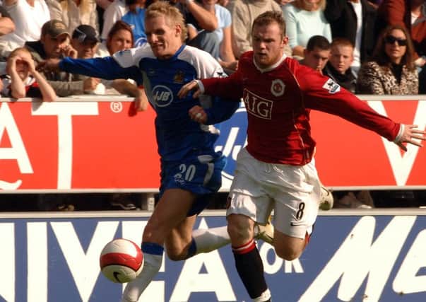 Gary Teale battles with Wayne Rooney