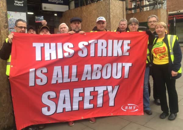 RMT striking outside Wigan Wallgate station earlier this year