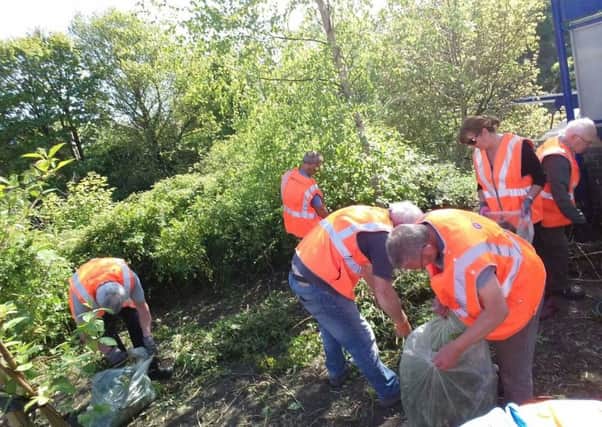 The Friends of Orrell Station hard at work
