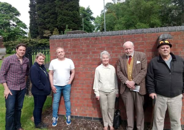 Artist Mark Mennell, Tracey Williams from Wigan and Leigh Homes, tenants' representative Chris Brady, Thomas Woodcock VC's granddaughter Veronica Ashton and historians Tom Walsh and Terry Atherton at the spot where the new artwork will go