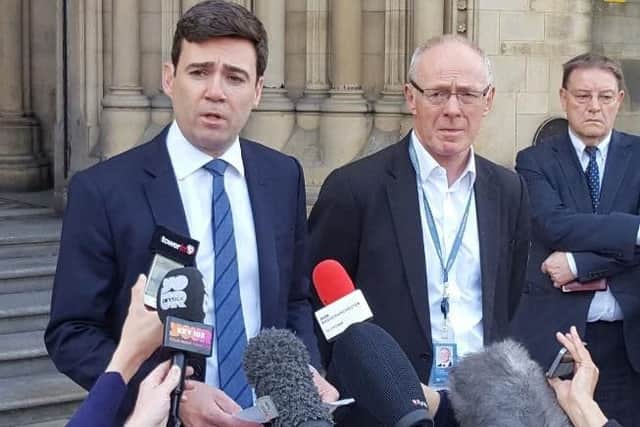 Mayor Andy Burnham reacts to the tragic events alongside leader of Manchester City Council Sir Richard Leese