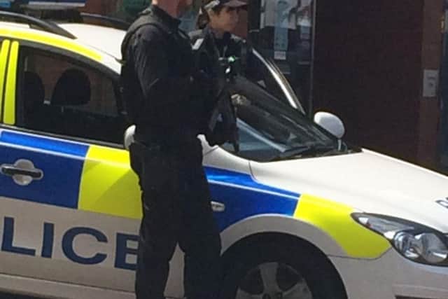 Police in the streets of Wigan with guns