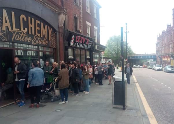 Wiganers queuing at Alchemy Tattoo Studio on Wallgate
