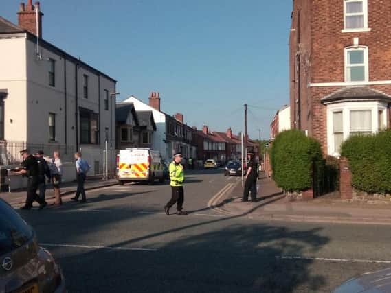 The street in Wigan on lockdown as terror searches continue