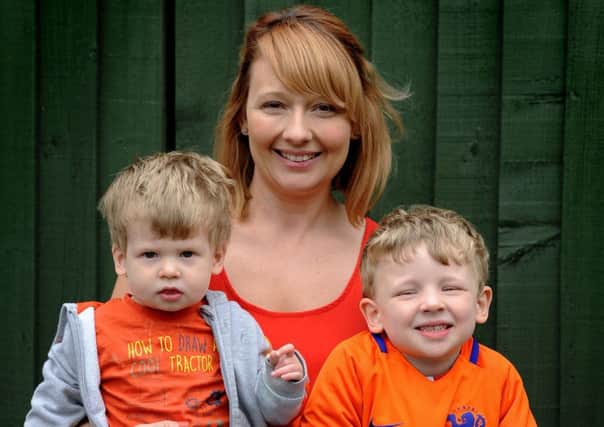 Claire Rawlinson with son Stanley, who has many allergies, and his big brother Charlie