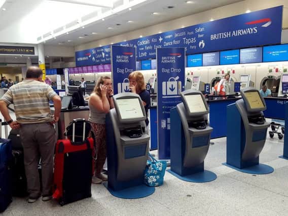 Queues at British Airways check in desks at Heathrow Airport, as stranded holidaymakers spent the night on yoga mats on airport floors as disruption from the British Airways system failure continued into a second day.