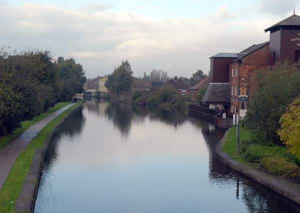 The man was found in the canal near Leigh Bridge