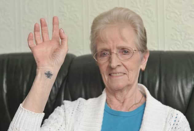 Ann Banks (80) from Wigan, who got the Worker Bee tattoo in tribute to the victims of the Manchester terror attack. See ROSS PARRY story RPYTATTOO.  This is the incredible moment an 80-year-old pensioner showed her respect to those killed during the Manchester terror attack -- by having a bee tattoo.  Ann Banks felt heartbroken following the nail bomb massacre last month and decided have the emblem of Manchester inked on her right wrist  - the first tattoo she has ever had.  Tattooists at the parlour say she is one of the oldest people to have walked through their doors.