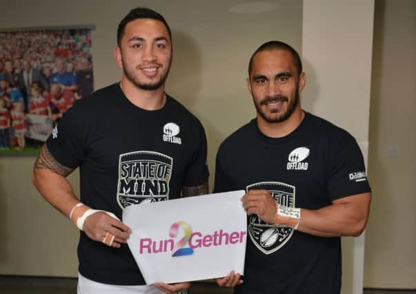 Harrison Hansen and Thomas Leuluai encouraging people to Run2gether for Wigan and Leigh Hospice in the Leigh Community 10k