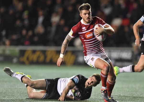 Wigan Warriors' Oliver Gildart races through to score his team's 2nd try