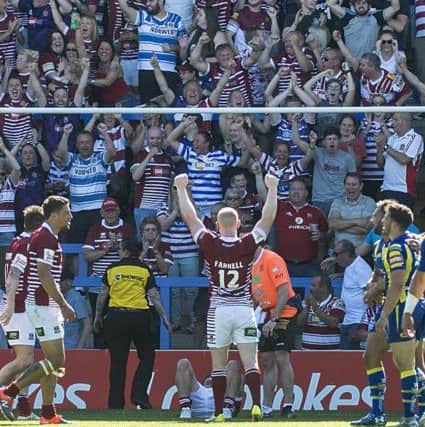 Farrell celebrates in front of the Wigan fans