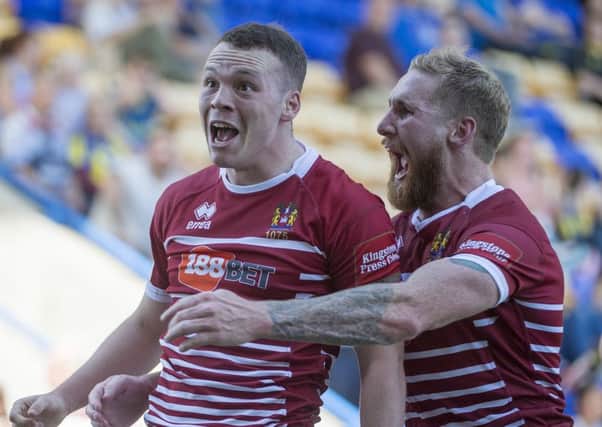 Liam Marshall celebrates his 20th try of the season with Sam Tomkins