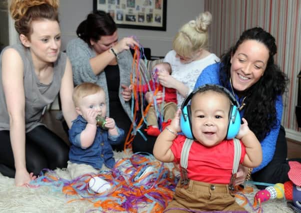 Faye Kerry with her nine-month-old son Ziah, right, from Stanningley who is organising Baby Rave