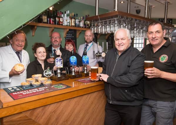 Martland Mill Brewery Owners Delia and Paul Woodin the bar of their Tap & Barrel Pub in Jaxons Square, Wigan, with (from left to right) Brian Gregory Greenhalghs Fleet Sales Manager; Delia Wood; Venue Events Manager for Inspiring Healthy Lifestyles Martin Turner; Helen Mcdonough Manager Of The Jazz Cafe and Jazz Lounge; Simon Byrom, General Manager Food and Beverage Ihl; Festival Director Ian Darrington and Paul Wood