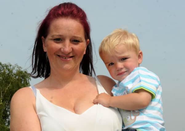 WIGAN  21-06-17
Michelle Smith, 32, from Wigan, has been diagnosed with incurable breast cancer, pictured with son George, one,   - Michelle's colleagues are raising funds to send the family to Disneyland Paris.