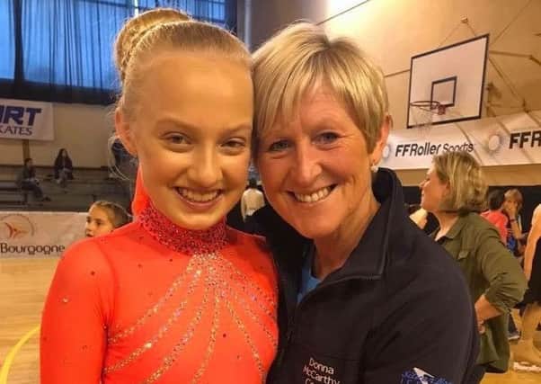 Lily Elsworthy, 13, is the novice ladies world inline skating division three skating champion. She's pictured with her coach Donna McCarthy