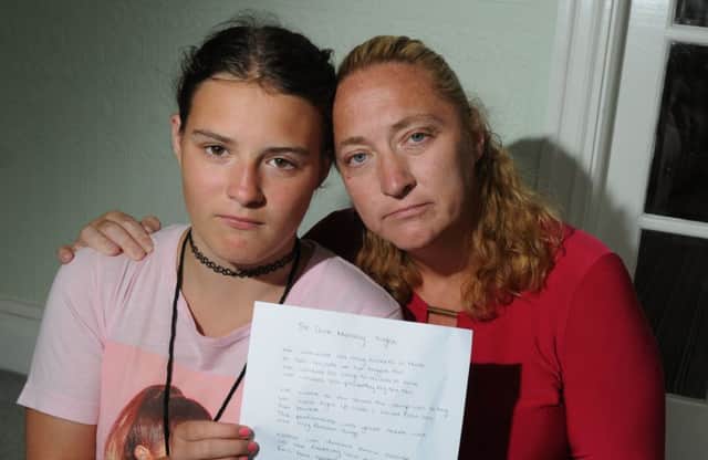 Wigan teenager Jessica Fisher has written a poem about the Manchester Arena bomb as she was at gig but wasn't injured, pictured with her mum Emma, right