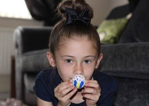 Hollie Bannister, who inspired grandad Steve Rowe to launch his Design A Table Tennis Ball competition