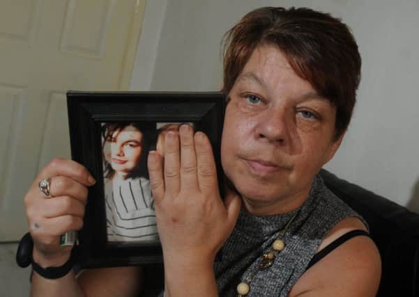 June Lomax from Leigh, with a photograph of her daughter Sandra